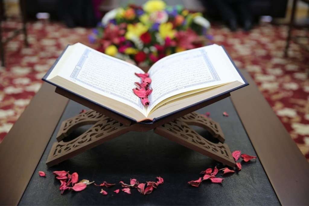 Quran with flowers to answer can you learn the Quran while on your period